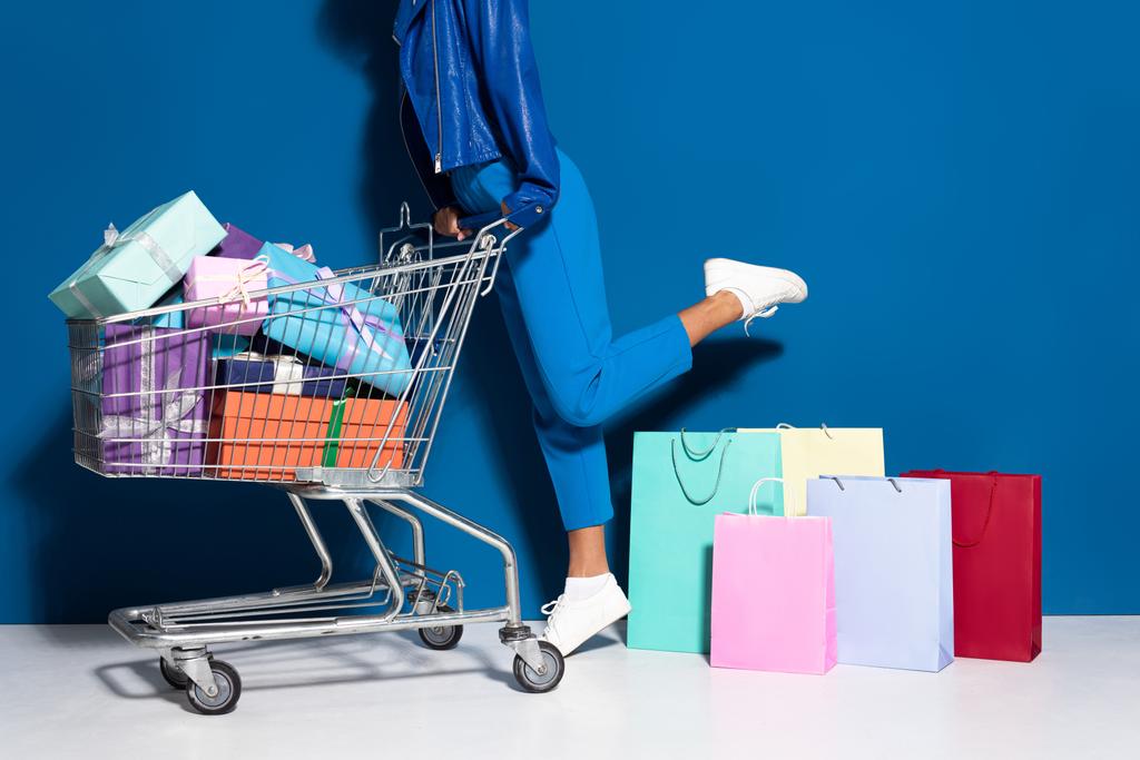 stock-photo-cropped-view-african-american-woman-shopping-cart-full-gifts-shopping.jpg